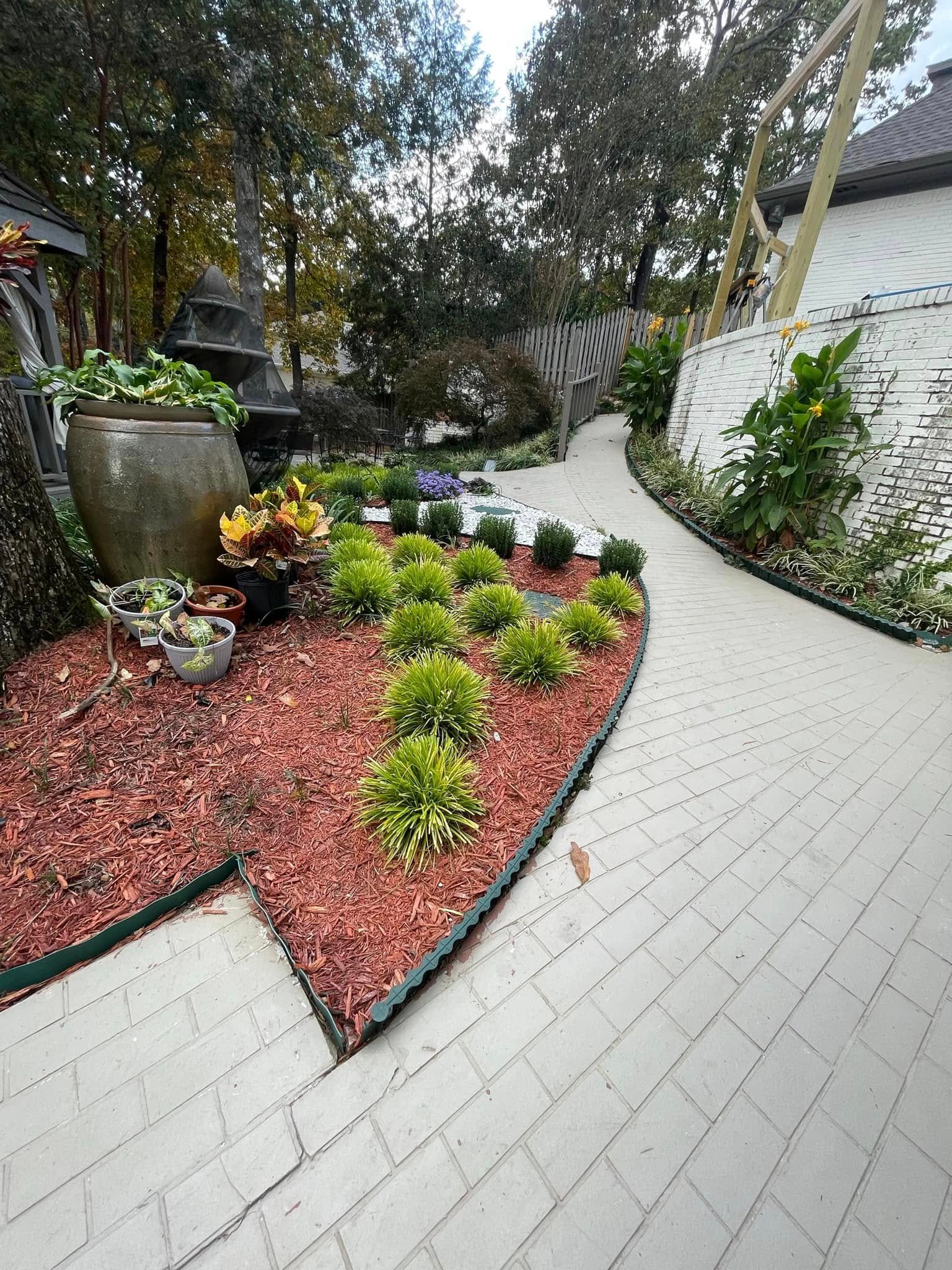 Piso de piedra natural y jardín instalado por PR Landscaping LLC