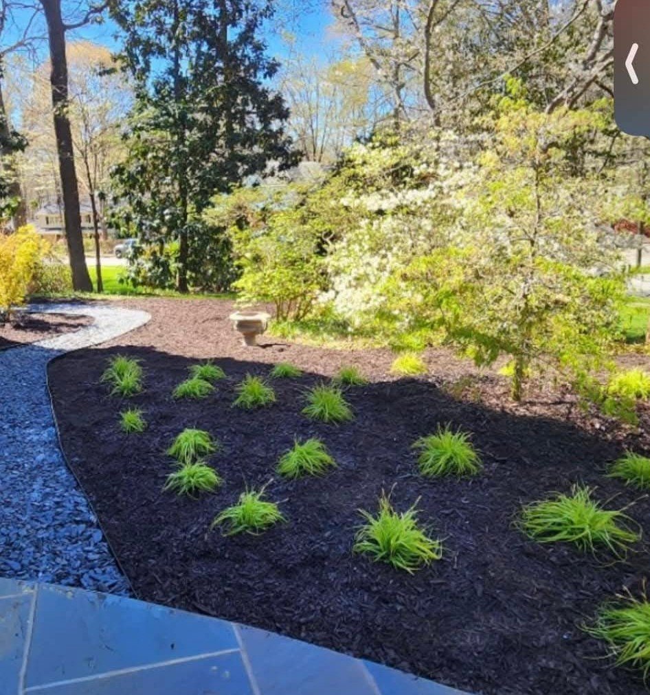 Stone steps and garden bed installed by PR Landscaping LLC